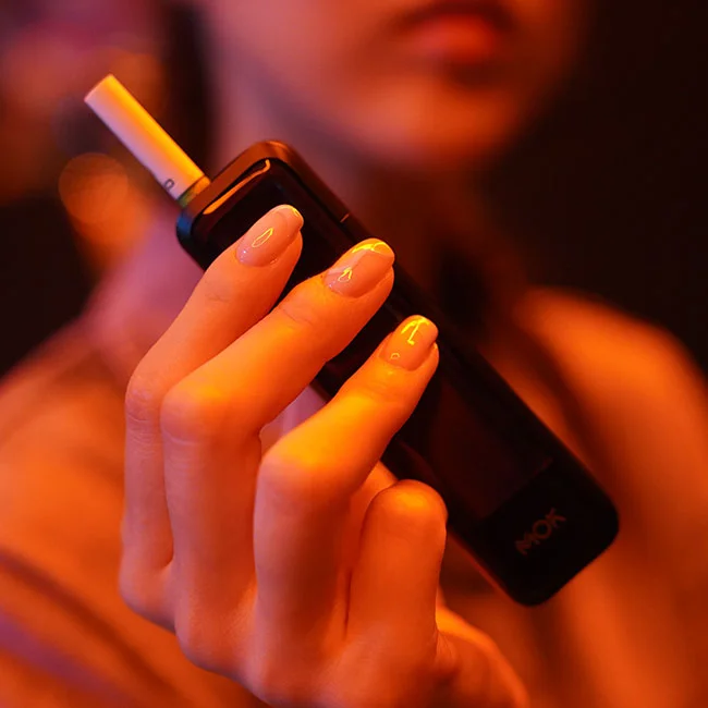 Woman holding a MOK device